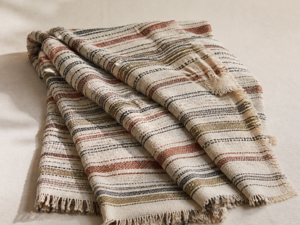 Handwoven Cotton Throw - hero Handwoven Cotton Throw on a warm neutral background